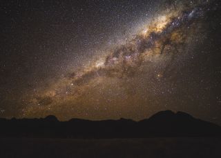 The starry Milky Way above the volcanic silhouette - Warrumbungles